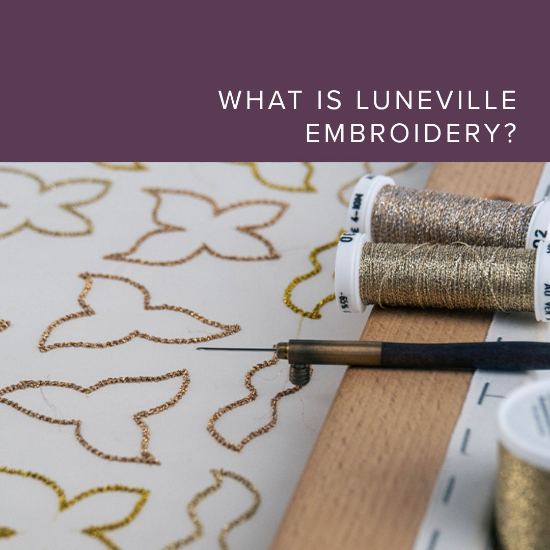 A tambour embroidery hook placed on a fabric design with metallic thread, showcasing the setup for Luneville embroidery — a couture embellishment technique using a hook from the reverse side of the fabric