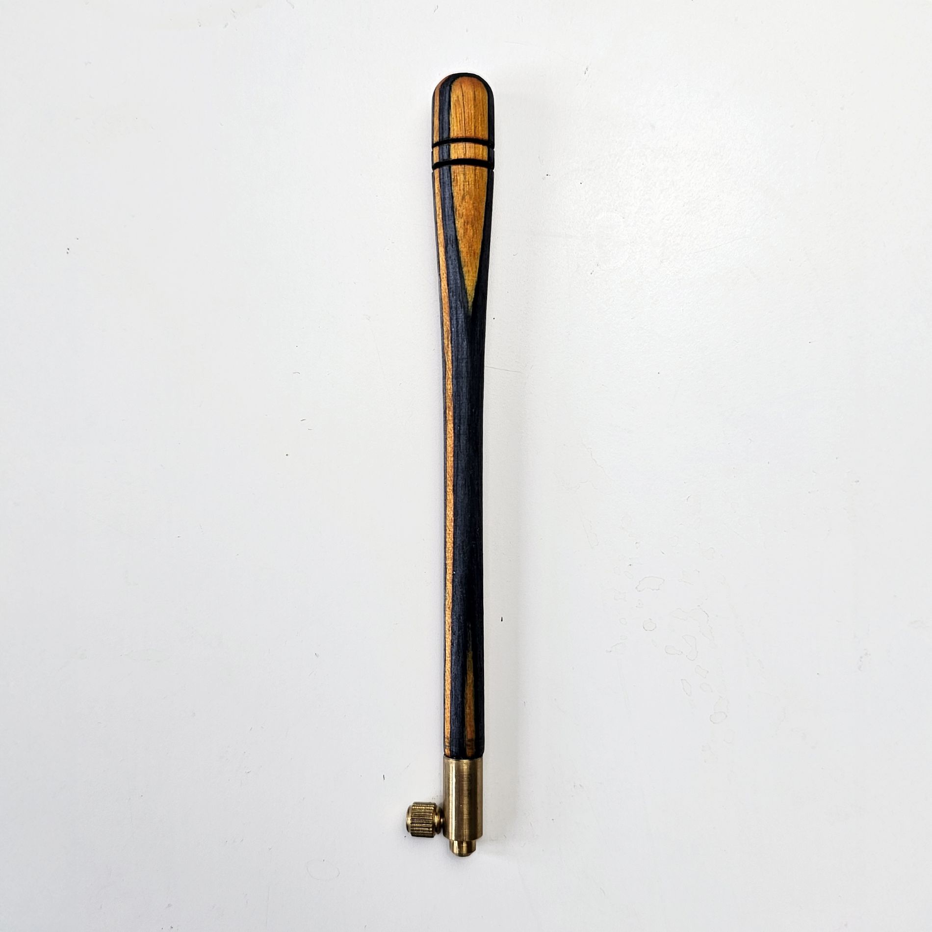 Striped ash tambour hook with contrasting black and golden wood design, brass screw fitting, and size 70 needle for bead and sequin embroidery